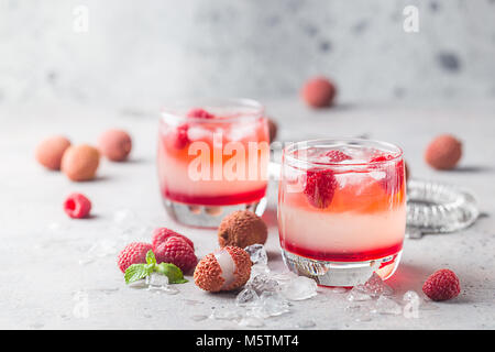 Cold lychee and raspberry cocktail Stock Photo