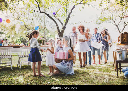 Family celebration or a garden party outside in the backyard. Stock Photo