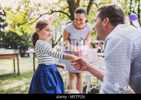 Family celebration or a garden party outside in the backyard. Stock Photo