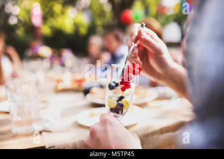 Family celebration or a garden party outside in the backyard. Stock Photo