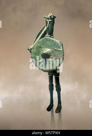 Iron Age Nuragic broze statue of a soldier with a shield and sword from Monte Arcosu di Uta, Sardinia. Museo archeologico nazionale, Cagliari, Italy.  Stock Photo