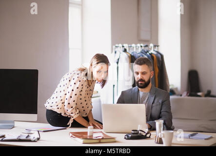 Two business people in the office. Stock Photo