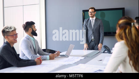 Perspective businesspeople having meeting in conference room Stock Photo