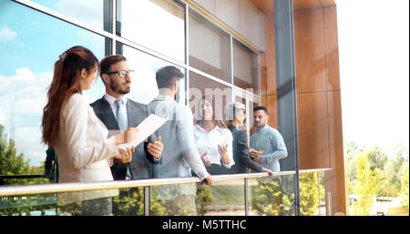 Business colleagues having conversation during coffee break Stock Photo