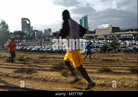 Joggers are running at Meskel square ( Addis Ababa, Ethiopia) Stock Photo