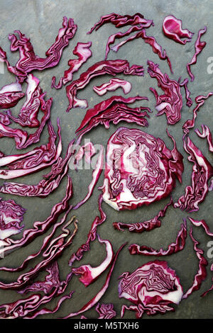 Arrangement of colorful red cabbage on slate table Stock Photo