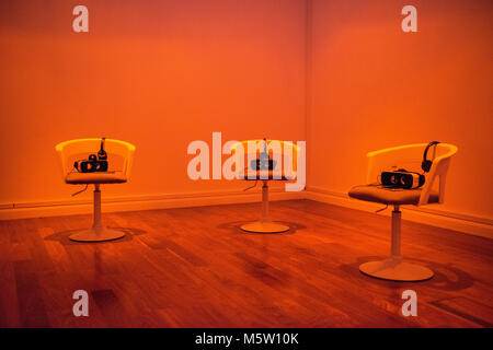 chairs laid out for an exhibition of virtual reality art work in a gallery Stock Photo