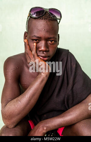A Portrait Of A Young Man From The Bodi Tribe, Bodi Village, Omo Valley, Ethiopia Stock Photo