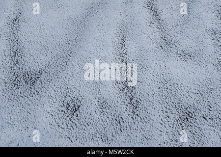 Snow on Gravel - 70% White, 30% Black with darker Streaks.  Fine Textured Background without adding Color Stock Photo