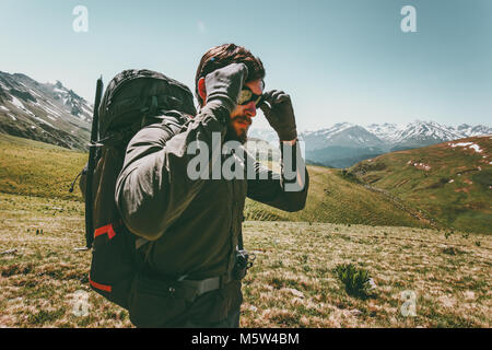 Backpacker Man hiking in mountains  Travel Lifestyle survival concept adventure outdoor active vacations mountaineering sport wild nature Stock Photo