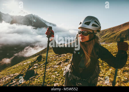 Happy woman enjoying sunset mountains landscape Travel healthy lifestyle adventure concept active summer vacations outdoor climbing sport Stock Photo