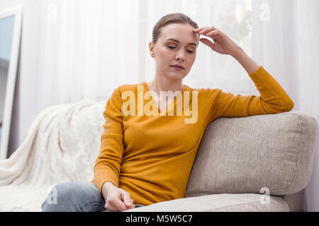 Exhausted pretty woman feeling tired Stock Photo