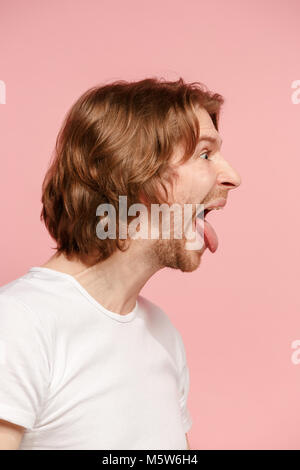 The man with crazy expression isolated on pink Stock Photo