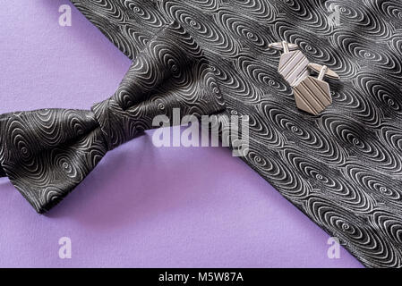 Bow tie silver cufflinks and handkerchief. Stock Photo