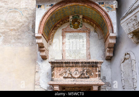 Sarcophagus of the Abati - Sarcofago degli Abati - on the external faÃ§ade of the little church of Sant'Apollinare, Trento, Trentino Alto Adige, Italy Stock Photo