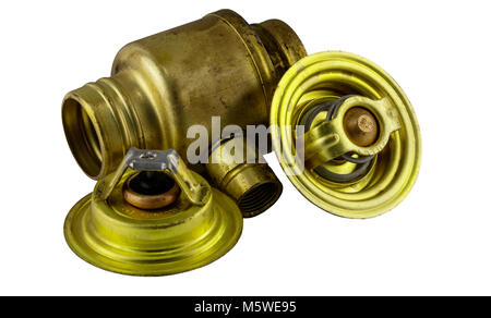 Antique vintage american automobile brass thermostat assemblies on a white background. Stock Photo