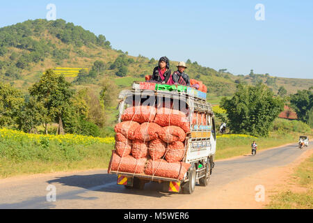 Kalaw: rural road, truck, bags with oranges, , Shan State, Myanmar (Burma) Stock Photo