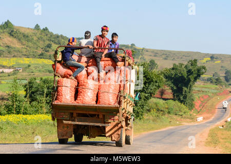 Kalaw: rural road, truck, bags with oranges, , Shan State, Myanmar (Burma) Stock Photo