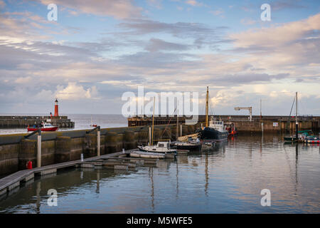 The harbour with lighthouse at Watchet a seaside town in the English county of Somerset between Minehead and Bridgewater in the Exmoor national park. Stock Photo