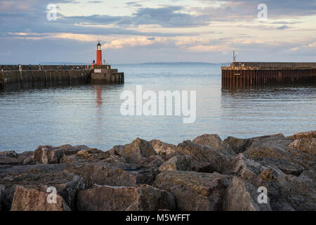 The harbour with lighthouse at Watchet a seaside town in the English county of Somerset between Minehead and Bridgewater in the Exmoor national park. Stock Photo