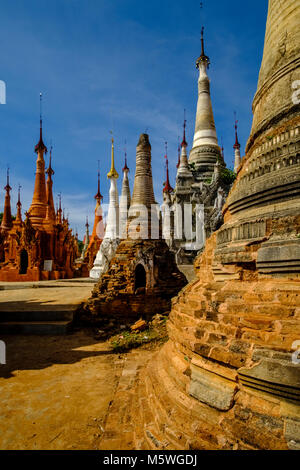 The partly ruined monuments of Shwe Indein Pagoda are located in the village of Indein close to Inle lake Stock Photo