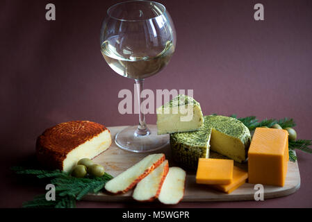 Mix cheese on wooden cutting board.Top view. Stock Photo