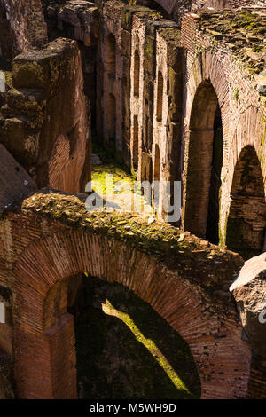 Interior closeup detail of he Colosseum or Coliseum, also known as the Flavian Amphitheatre, with the below ground level hypogeum, Rome. Lazio. Italy. Stock Photo