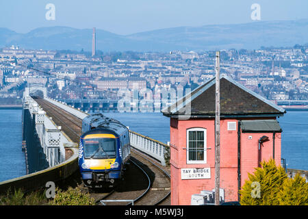 View of Scotrail diesel passenger train travelling towards Dundee across the Tay Rail Bridge at Wormit in Tayside, Scotland, United Kingdom Stock Photo