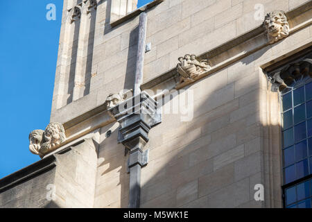 Carved stone three men in a boat and dodo gargoyles / grotesques on the Bodleian library. Oxford, Oxfordshire, England Stock Photo