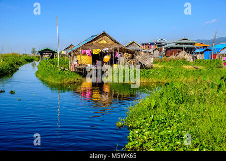 The fishermans houses are built on stilts between the swimming gardens in the village of Maing Thauk on Inle lake Stock Photo