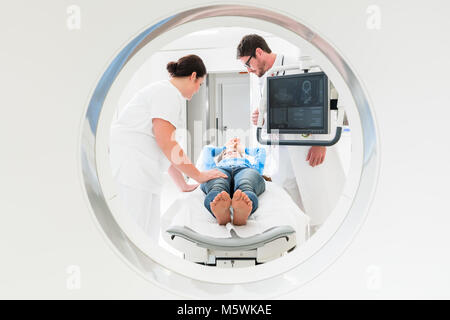 Doctor, nurse, and patient at CT scan Stock Photo