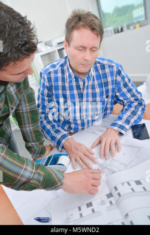 Let's go over the blueprints Stock Photo - Alamy