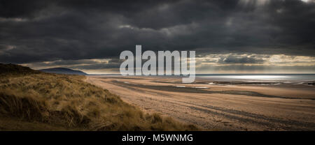 Drigg Beach on the West Coast of Cumbria under stormy skies Stock Photo