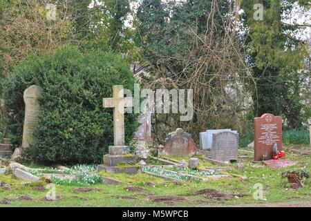 Headstone in graveyard at St Lawrence Church, West Wycombe, UK Stock Photo