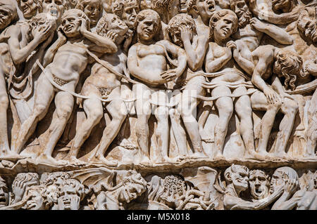 Close-up of the opulent and elaborated embossed sculptures in the Orvieto Cathedral (Duomo) on a sunny day in Orvieto, a well preserved medieval town. Stock Photo