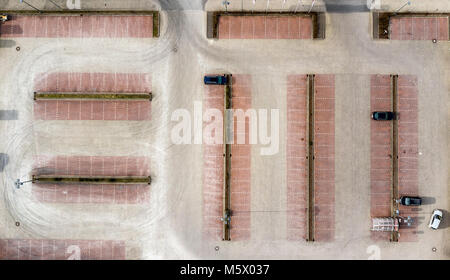 Vertical aerial photo taken from an empty parking lot of a consumer market, abstract aerial view, made with drone Stock Photo