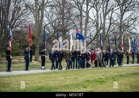 (Front row) Australian Prime Minister Malcolm Turnbull (left) is escorted by Maj. Gen. Michael Howard (center), commanding general, Joint Force Headquarters – National Capital Region and U.S. Army Military District of Washington; and Chairman of the Joint Chiefs of Staff Gen. Joseph Dunford (right), during an Armed Forces Full Honors Wreath-Laying Ceremony at Arlington National Cemetery, Arlington, Virginia, Feb. 22, 2018.     Turnbull met with Arlington National Cemetery senior leadership, toured the Memorial Amphitheater Display Room, and placed a wreath at the Tomb of the Unknown Soldier as Stock Photo