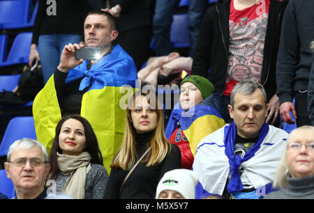 Kiev, Ukraine. 26th February 2018. Audience listen to National anthems before FIBA World Cup 2019 European Qualifiers game Ukraine v Sweden at Palace of Sports in Kyiv. Credit: Oleksandr Prykhodko/Alamy Live News Stock Photo