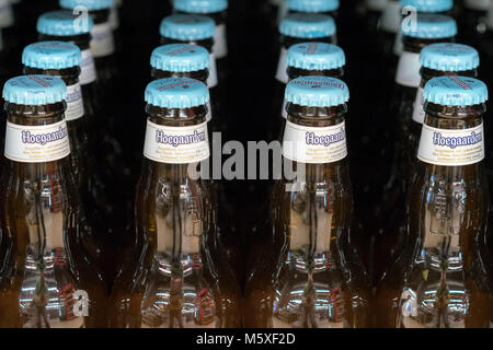 Kiev, Ukraine. February 18 2018. Hoegaarden beer bottles on store shelf. Hoegaarden Brewery is a brewery in Hoegaarden, Belgium, and the producer of a Stock Photo