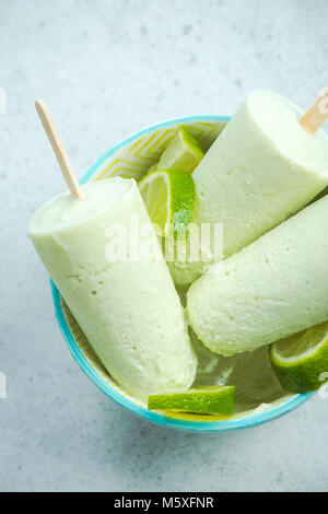Lime and coconut milk popsicles. Stock Photo