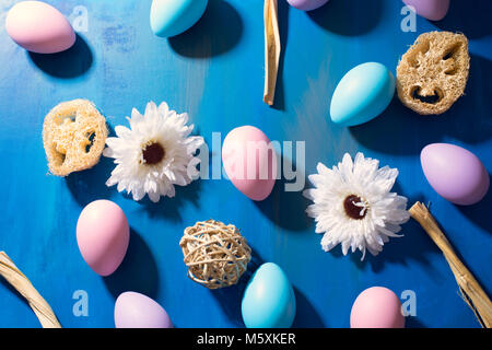 Beautiful Easter composition: colorful dyed eggs on a dark blue background Stock Photo