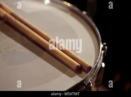 Drumsticks resting on the snare drum, for music,entertainment themes ...