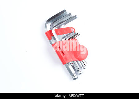 Set of imbus or Allen keys on a white background. Construction or repair tools in red plastic case. Stock Photo