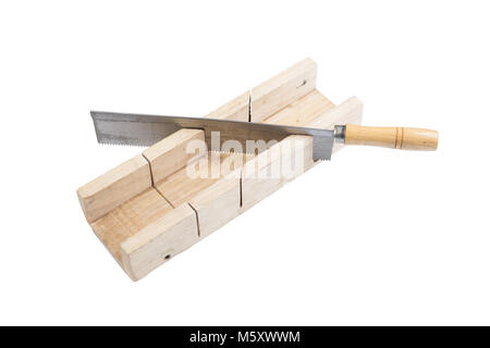 Metal saw with wooden handle standing in a wooden miter box. Construction tools, equipment isolated on white background, surface. Stock Photo