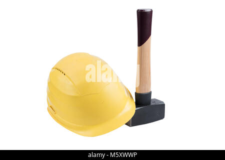 Yellow safety helmet on a small sledgehammer with wooden handle isolated on a white background, surface. Path saved, cut out. Construction equipment. Stock Photo