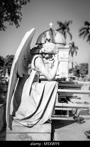 Cristobal colon catholic cemetery chapel and column with angel in the foreground, Vedado, Havana, Cuba Stock Photo