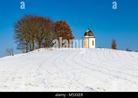 Chapel on a hill in Bavaria, Germany in winter Stock Photo