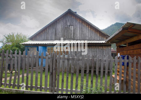 Old post office (rural house, wooden house) in Russian village. Altai republic, old village Kupchegen, Chuyskiy trakt (way) Stock Photo