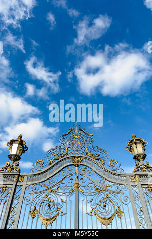 Low angle view of the richly decorated main entrance gate of the Noisiel public park, in the eastern suburbs of Paris, with golden wrought iron leaves Stock Photo