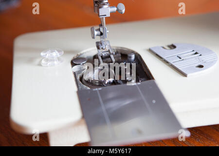 Sewing Machine Needle and Feed Dogs Closeup Stock Photo